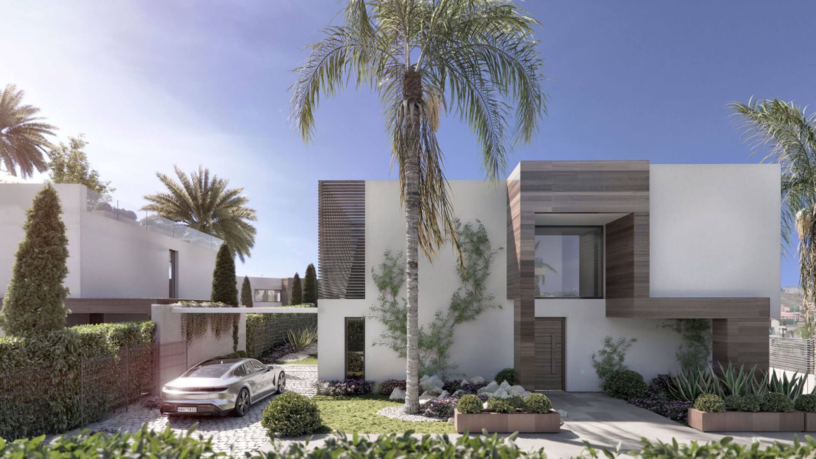 Außenansicht von Villas Azahar mit moderner Architektur und üppiger Landschaftsgestaltung.